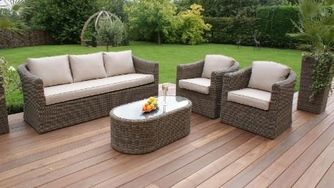 Stylish outdoor furniture set featuring a modern sofa, chairs, and a center table, perfect for gardens and patios in Dubai.