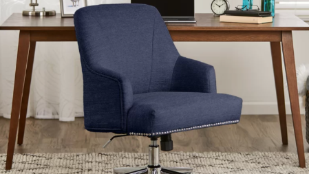 A sleek gray chair placed in a modern office space, adding a professional and stylish touch to the environment.