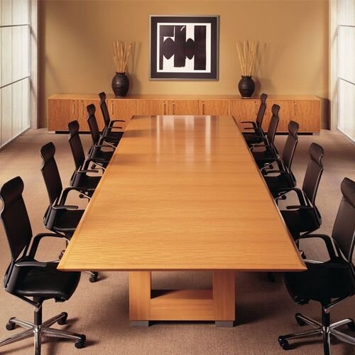 Spacious dining area with large wooden table and chairs