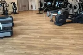 Durable vinyl gym flooring with a sleek finish, perfect for fitness centers and home gyms, offering comfort and easy maintenance in Dubai.